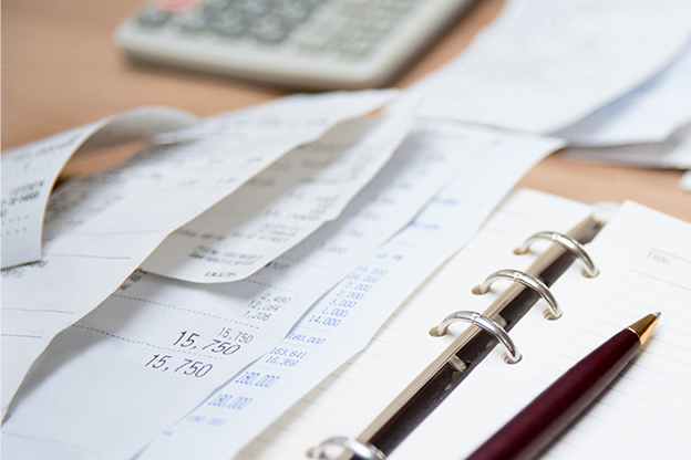 Receipts for purchases displayed on a notebook