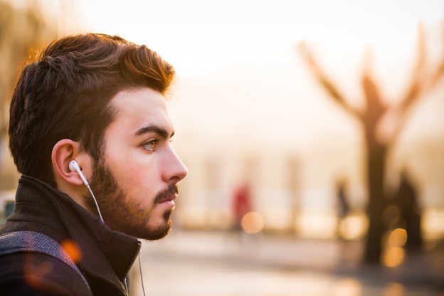 Male with earphones in